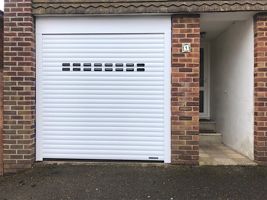 Window slotted electric roller shutter installed in Bournemouth