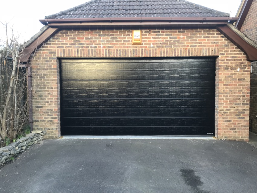 Black overhead roller shutter garage door