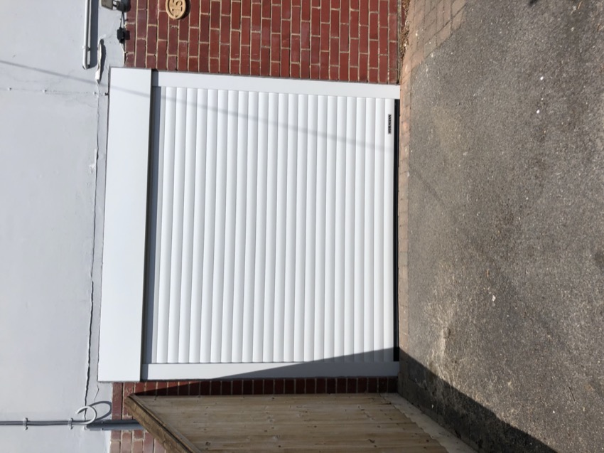 Electric roller garage door in white